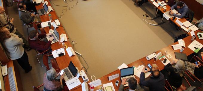 People gathered around a large conference table