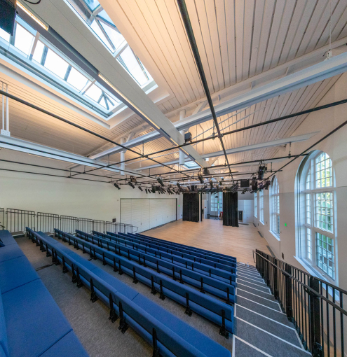 A view from the top of the telescopic seating down to the stage floor of the DR Center