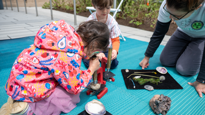 Children play with and explore river sediments with Strawtown Studio