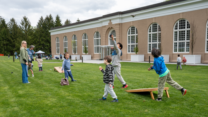 Children play cornball outside of the David Rockefeller Creative Arts Center