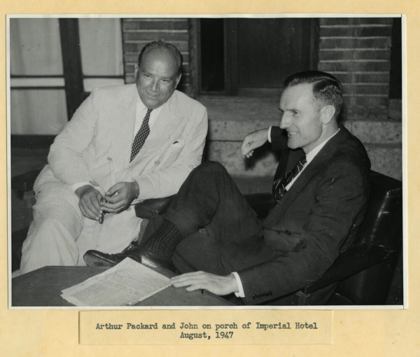 Arthur Packard sits on the left, with John D. Rockefeller 3rd on the right.
