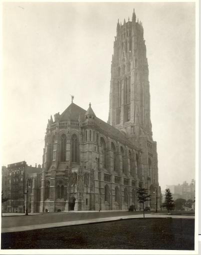 The exterior of a sprawling church built in the Neo-Gothic style.