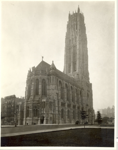 The exterior of a sprawling church built in the Neo-Gothic style.