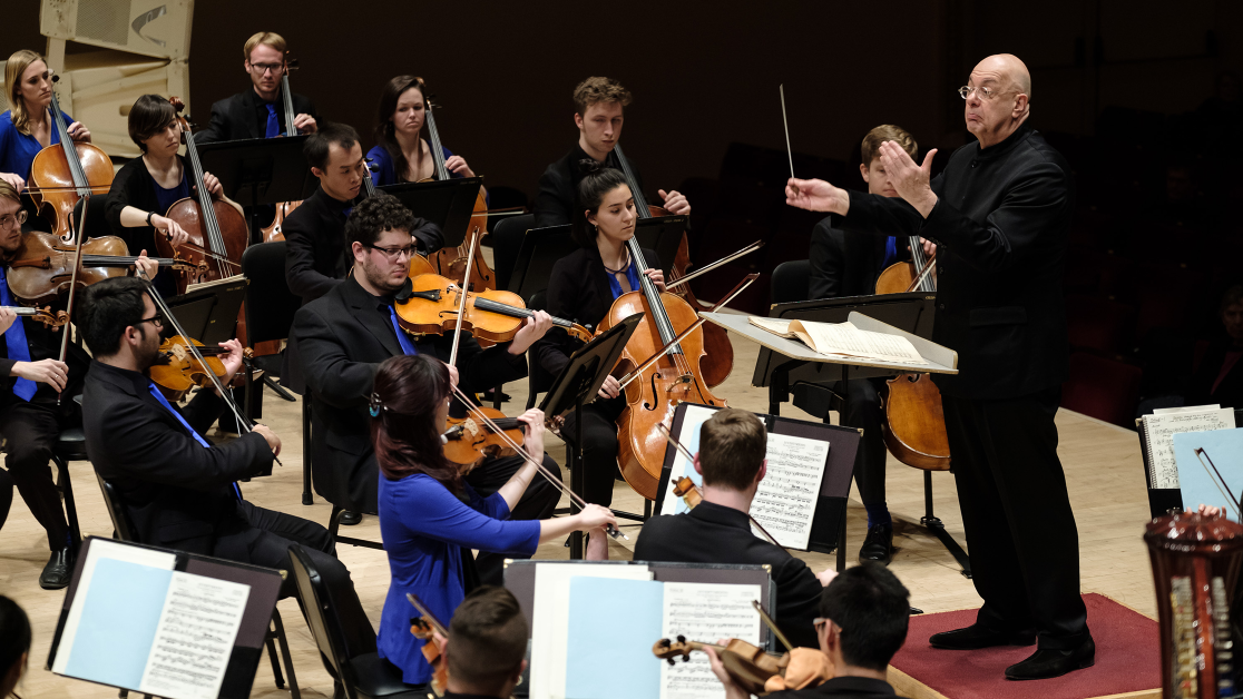 A conductor and orchestra