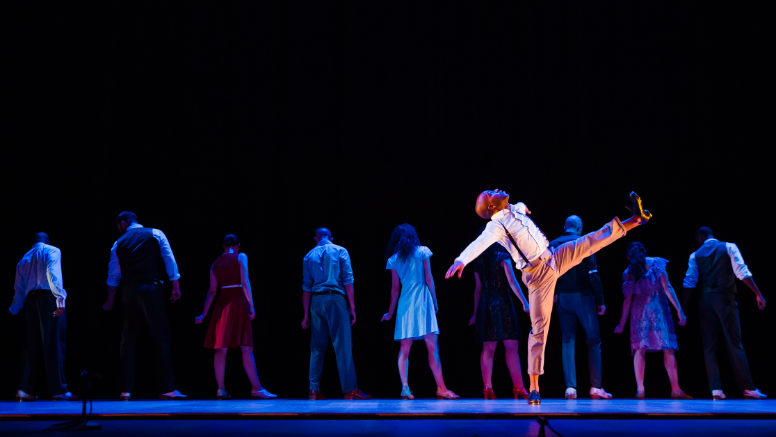 Dancers on a darkened stage