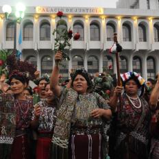Indigenous Guatemalan women celebrate outside the court