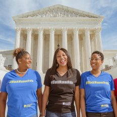 Five women in front of the U.S. Supreme court wearing shirts that say #blackwomenvote