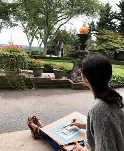 A college student sketches the landscape at Pocantico