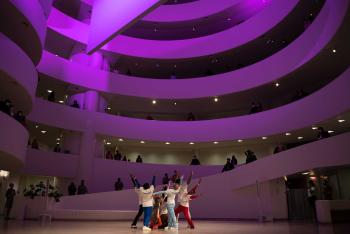 dancers perform in the guggenheim rotunda